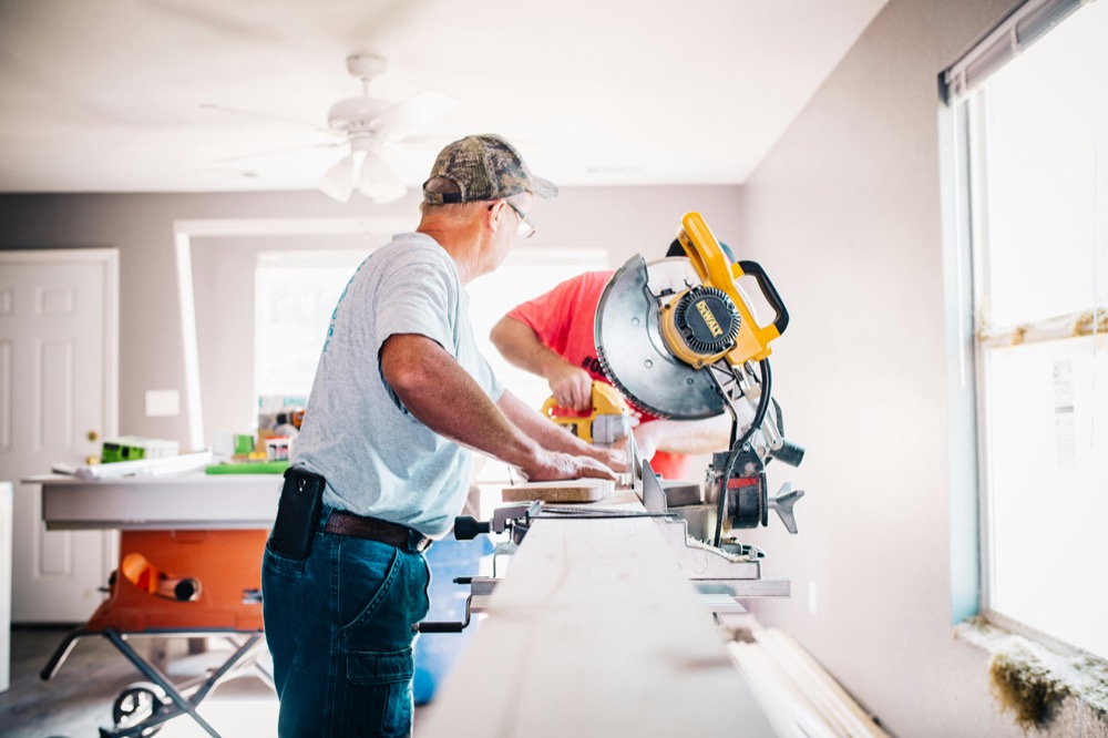 Home remodeling contractor on phone